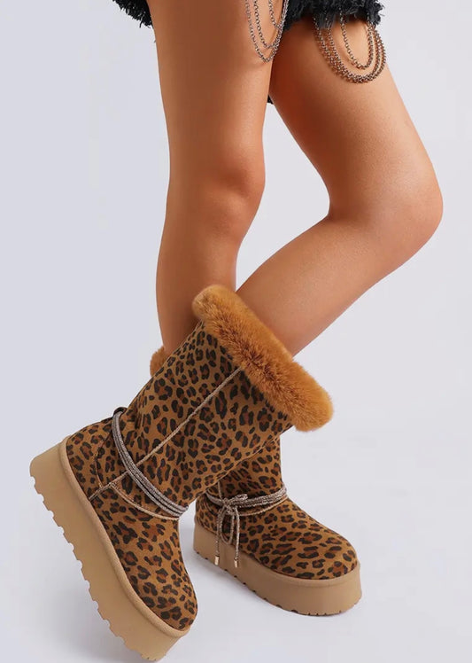 Meet your new cold weather obsession. The Bad Girl Cozy boots bring together bold attitude and serious comfort with a chunky anti skid platform sole, soft faux fur cuff and removable wraparound rhinestone strap detail that gives just the right amount of edge. Available in classic black, rich brown and fierce leopard. Whether you’re running errands, hitting the boutique or styling a casual fit with extra attitude these boots turn every sidewalk into a runway. 
Heel Height: 1.5 inch


Preorder Item SSB Underg